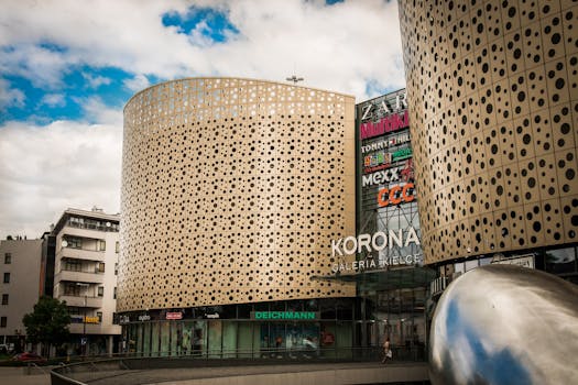 A contemporary shopping mall, Galeria Korona in Kielce, featuring unique architectural design.
